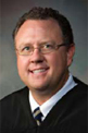 Commissioner Frank JOHNSON