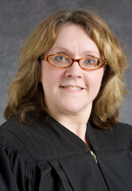 Commissioner Joan M. SINCLAIR